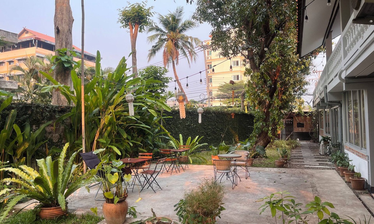 Chang Phueak House | Bright and Cozy Bedroom with AC in a Stylish Thai House, Primary Location.