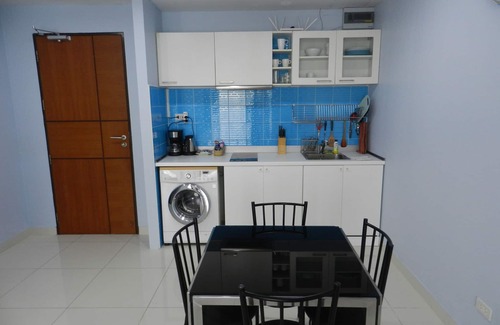 Jomtien Apartment | Apartment bedroom + living room.