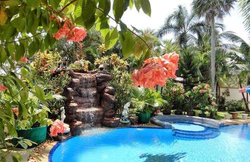 Nong Pla Lai Villa | Relaxing Palm Pool Villa & Tropical Illuminated Garden & Swimming Pool.