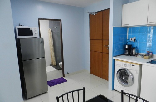 Jomtien Apartment | Apartment bedroom + living room.
