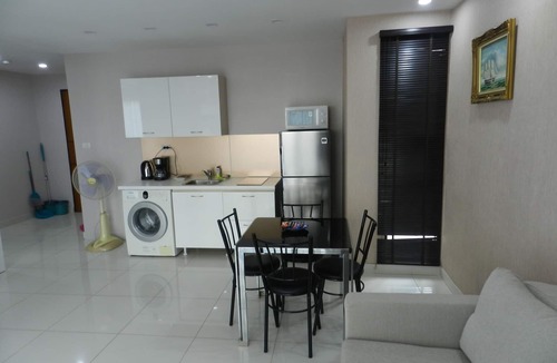 Jomtien Apartment | Apartment bedroom + living room.
