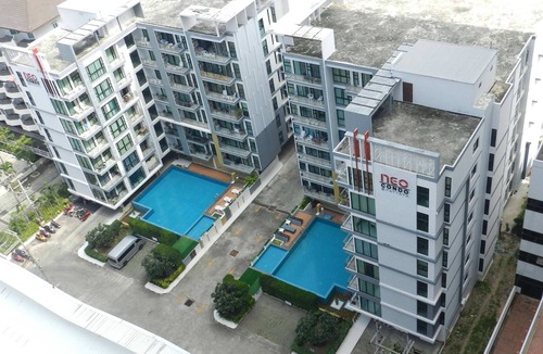 Jomtien Apartment | Apartment bedroom + living room.
