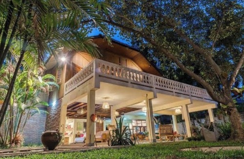 Chang Phueak House | Bright and Cozy Bedroom with AC in a Stylish Thai House, Primary Location.