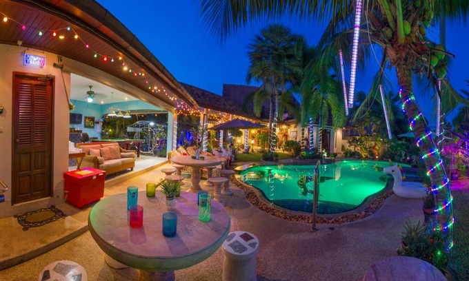 Nong Pla Lai Villa | Relaxing Palm Pool Villa & Tropical Illuminated Garden & Swimming Pool.